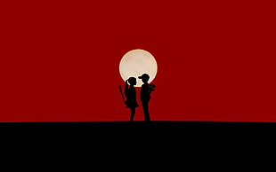 silhouette of boy and girl standing on moon