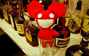 Deadmau plush toy in drinking glass