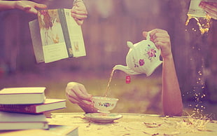 person holding teapot pouring teacup photography HD wallpaper