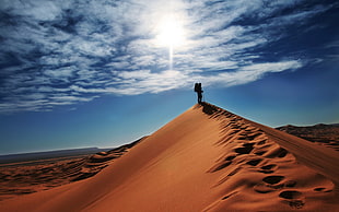 person on desert during daytime