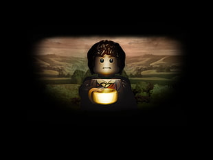 male holding container Lego character minifig, The Lord of the Rings, LEGO, Frodo Baggins