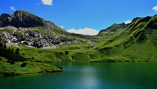landscape photo of  green mountains near body of water HD wallpaper