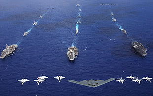 gray boat carrier and jets, military aircraft