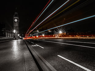 time lapse selective color photography of road near big bed tower during night time HD wallpaper