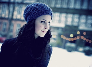 woman wearing black shirt and knitted cap bokeh photography