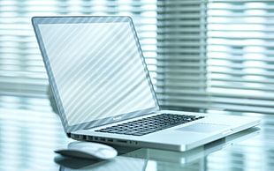 black and gray laptop computer with wireless mouse