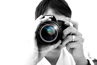 gray scale person holding Canon DSLR camera HD wallpaper