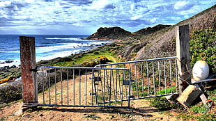 gray metal gate, lock, sea, landscape