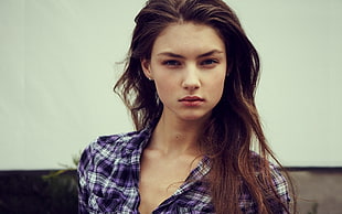 photo of woman in purple and white plaid sports shirt