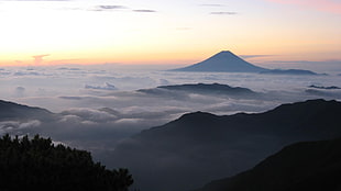 view of a mountain with sea of clouds