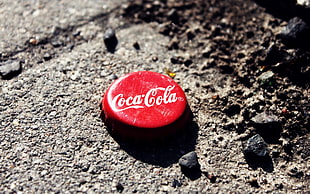 closeup photo of Coca-Cola lid