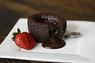 lava cake and strawberry on white plate