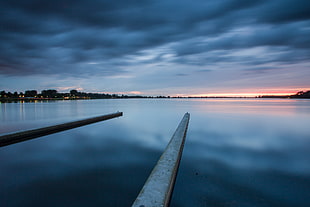 two dock and calm body of water