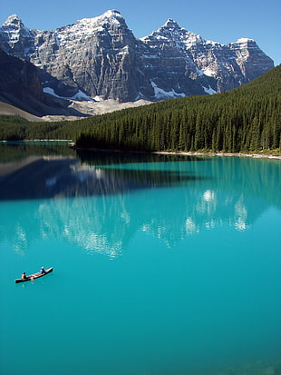 two people on boat in lake during daytime, banff national park, moraine lake