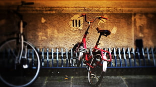 red folding bicycle on bicycle parking area