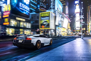 white Lamborghini on road during night timw