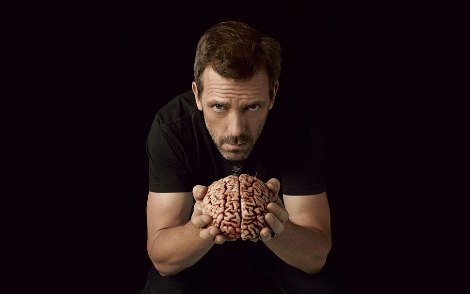 man holding a human brain HD wallpaper