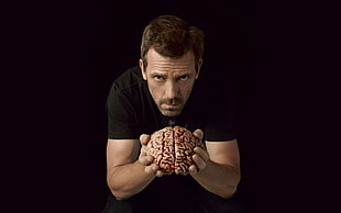 man holding a human brain