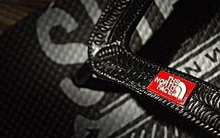 closeup photo of black The North Face bag HD wallpaper