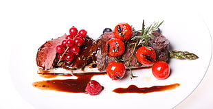 steak with cherry on plate