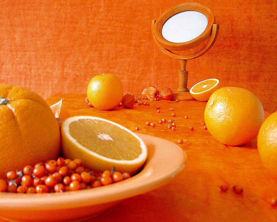 sliced orange on white ceramic plate with beans HD wallpaper