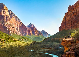 three person standing on brown rock formation near forest with river during daytime, zion national park HD wallpaper
