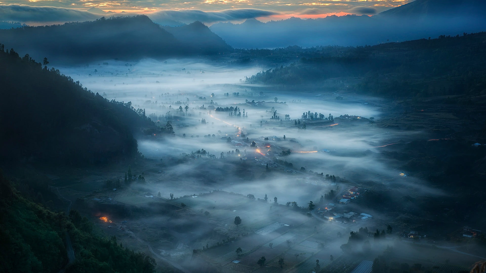 aerial photo of valley at night time