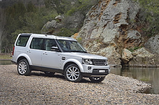 silver Range Rover beside of river