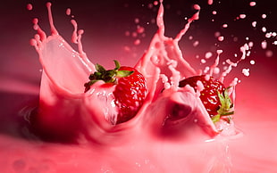 splash photography of two strawberries HD wallpaper