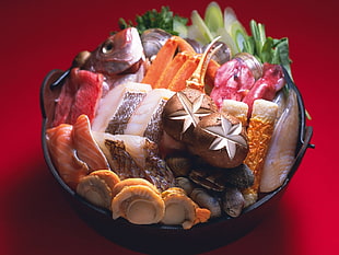 raw foods served on black ceramic bowl