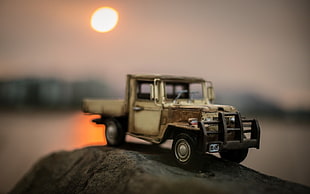 selective focus photography of gray die-cast truck
