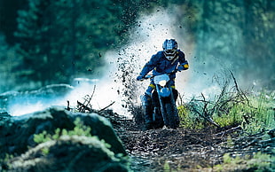 man riding motocross dirt bike