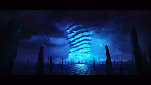 silhouette of trees on body of water across blue light-up tornado
