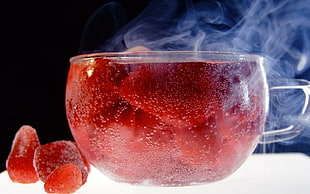 clear glass bowl with frozen strawberries