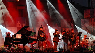 group of men playing instruments on stage