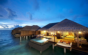 brown gazebo above water at daytime HD wallpaper
