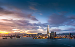 scenery of high-rise city buildings across the ocean HD wallpaper