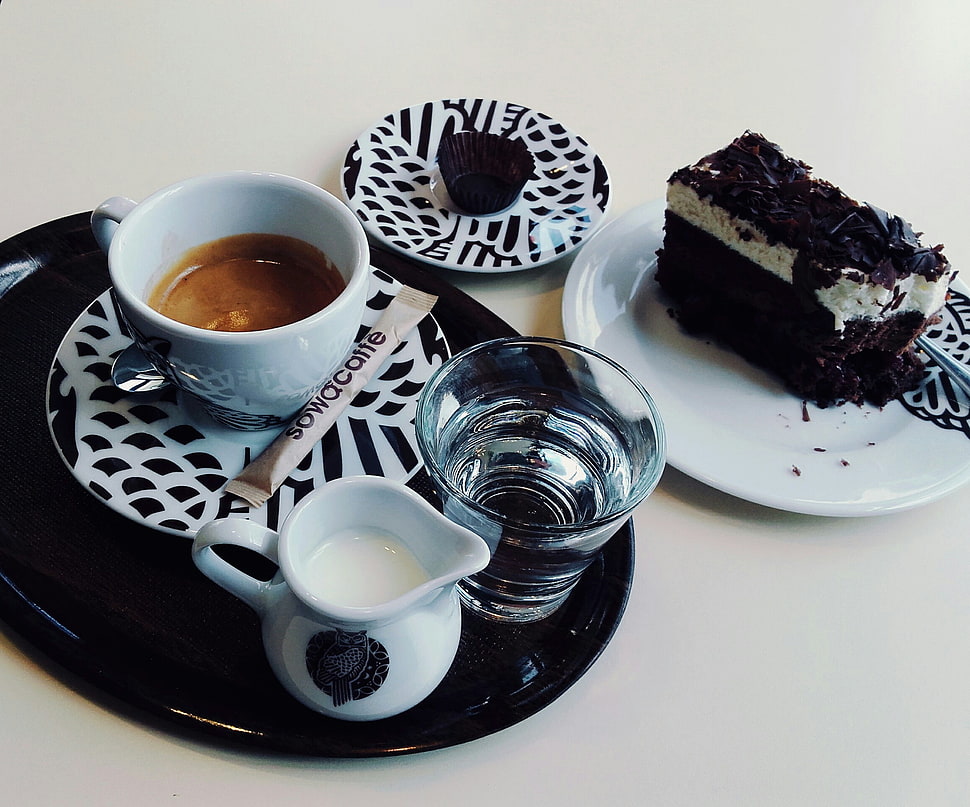 sliced chocolate cake and coffee on white and black ceramic plates HD wallpaper