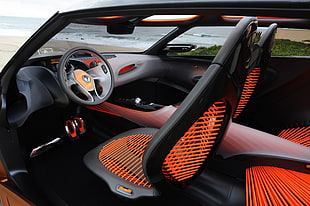 orange and black Renault car steering wheel and car bucket seat set