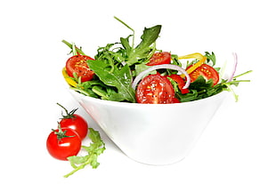 sliced tomatoes and leaf dish