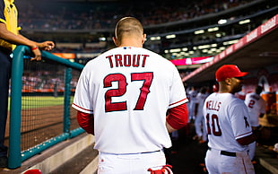 focus photography of man in Trout 27 baseball jersey in stadium