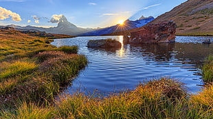 mountain view over body of water during daytime HD wallpaper