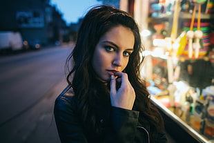 focus photo of woman wearing black jacket