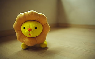 selective focus photography of lion plush toy