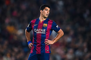 soccer player wearing Nike Qatar Airways jersey