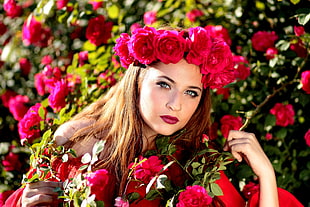 woman wearing red Rose headband posing in red Rose garden patch