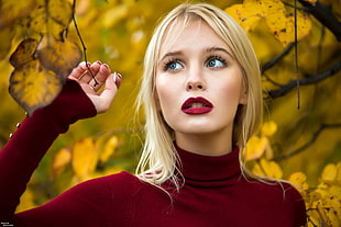 long blonde haired woman in red turtleneck long-sleeved top