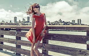 woman wearing red sleeveless midi dress during daytime HD wallpaper