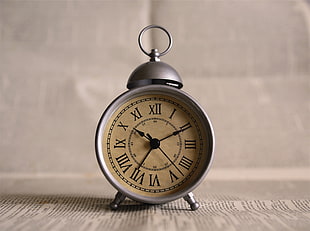 round silver analog alarm clock, clocks