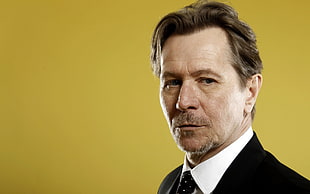 man wearing white dress shirt and black suit jacket